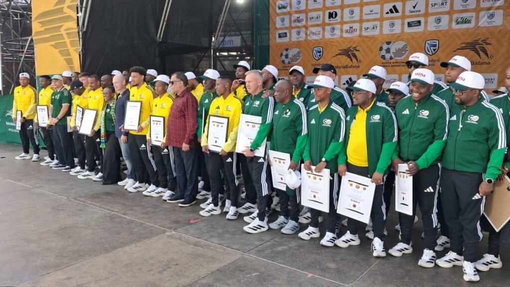 Bafana Bafana technical staff with World Cup participation certificates at send-off.