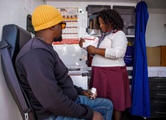 Gauteng rolls out Lenacapavir HIV prevention injection at 133 clinics Gauteng Lenacapavir HIV prevention injection rollout: healthcare worker and patient in Soweto mobile clinic.