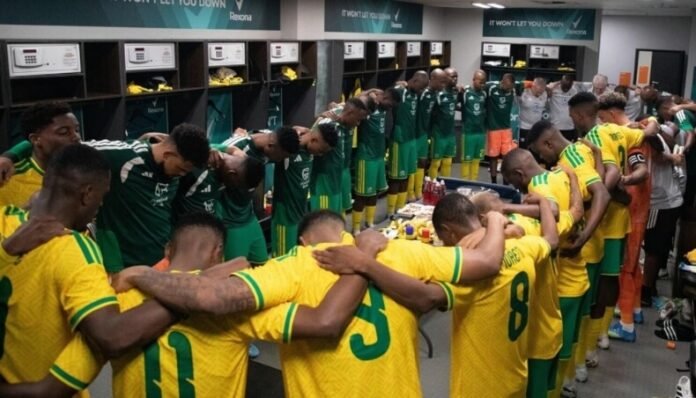 Bafana Bafana players celebrate reaching the World Cup 2026 Round of 32 in the locker room.