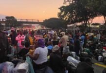 Mozambique offers Portugal and UAE jobs to workers repatriated from South Africa Malawian nationals wait with luggage at a Durban repatriation site before travelling home through Mozambique.