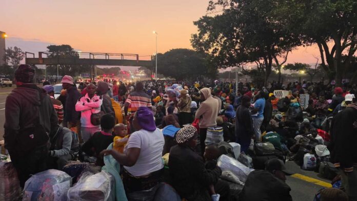 Malawian families wait with luggage at Durban repatriation centre ahead of the June 30 deadline.