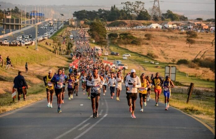 Comrades runners occupying closed road on Durban-Pietermaritzburg route during 2026 ultra-marathon near N3