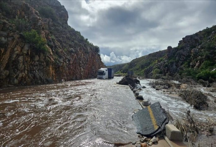 Truck stranded in floodwaters after severe weather damaged a road in the Western Cape Garden Route.