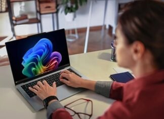 Can a laptop solve South Africa’s AI challenges? Lenovo thinks so Professional using the Lenovo ThinkPad X9 Aura Edition laptop at a desk in a bright modern workspace.