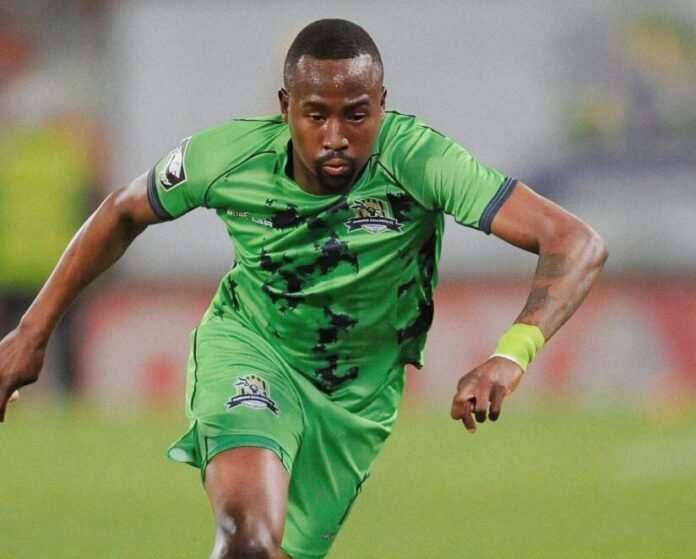 Marumo Gallants midfielder Thapelo Dhludhlu in action during a match wearing the club's green home kit.