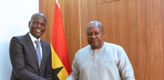 South Africa defeats Ghana’s AU bid to “single out and isolate” the country Ronald Lamola shakes hands with Ghana President John Mahama during a meeting in Accra, with Ghana's national flag behind them.