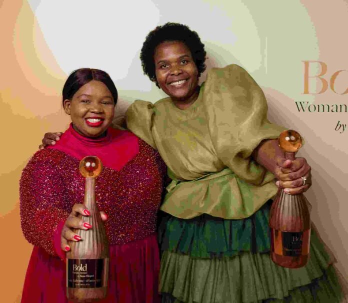 Pretty Kubyane and Lindiwe Nkuna-Kgopa pose with their 2026 Veuve Clicquot Bold Woman Award trophies.