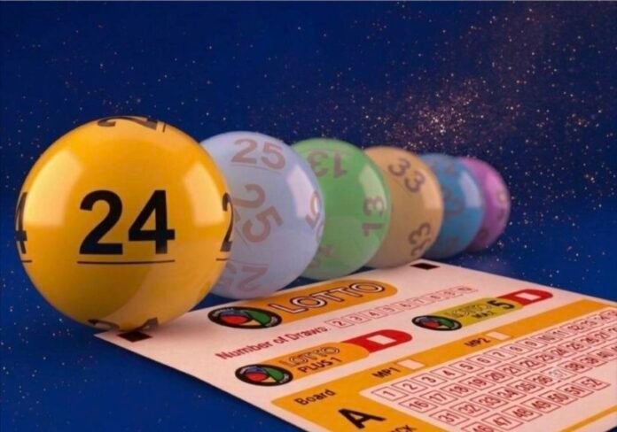 Yellow, blue, green and other numbered lottery balls arranged on a Lotto results slip.