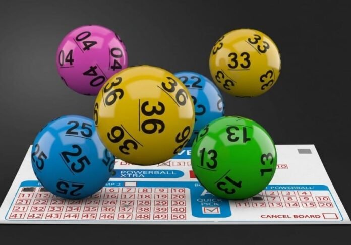 Colourful numbered PowerBall and PowerBall Xtra balls above a National Lottery betting slip.