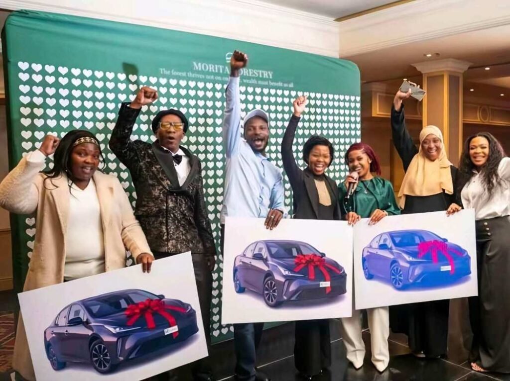 Morita Forestry top performers celebrate with vehicle prize boards at a July 2026 event.
