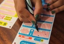 Daily Lotto results: Sunday, August 16 — Winning numbers Person marking numbers on a South African National Lottery playslip beside another ticket on a wooden table.