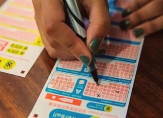 Daily Lotto results: Sunday, August 16 — Winning numbers Person marking numbers on a South African National Lottery playslip beside another ticket on a wooden table.