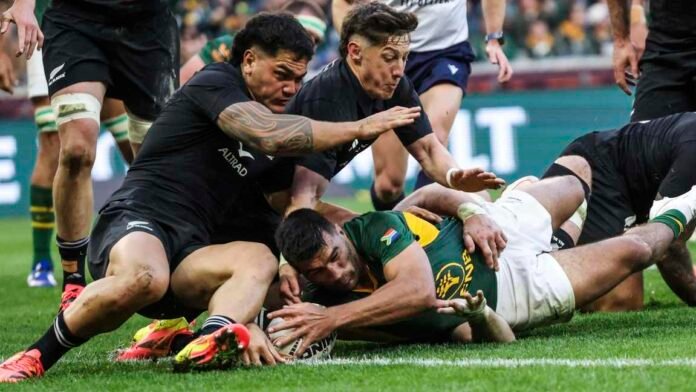 Springboks player grounds the ball as All Blacks defenders close in during the second Test in Cape Town.
