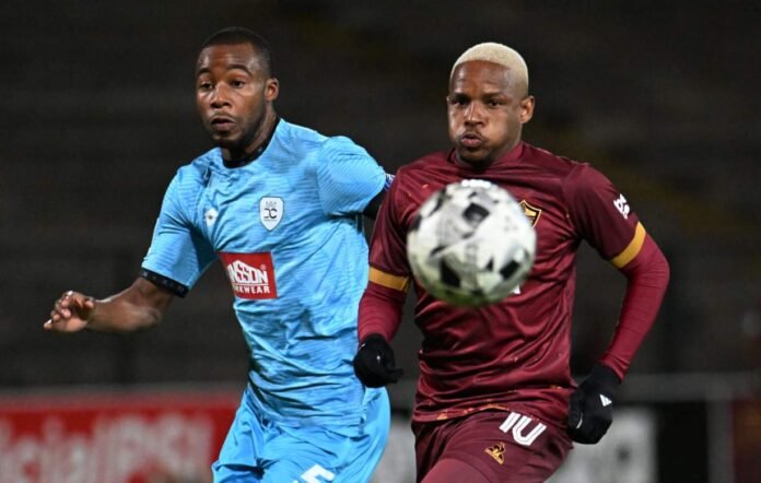 Durban City FC and Stellenbosch FC players compete for the ball in a Betway Premiership match
