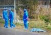Police offers R400,000 reward as 8th woman’s body found in Ekurhuleni Forensic investigators beside a covered body at an Olifantsfontein scene