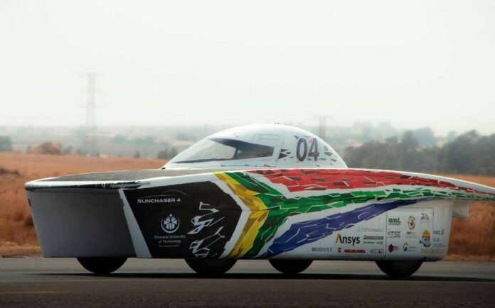 TUT SunChaser 4 solar car with solar panels and aerodynamic bodywork on a road.