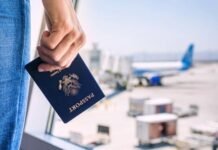US visa restrictions on South Africans: Who is affected and what it means Hand holding a US passport at an airport amid new visa restrictions for South Africans.