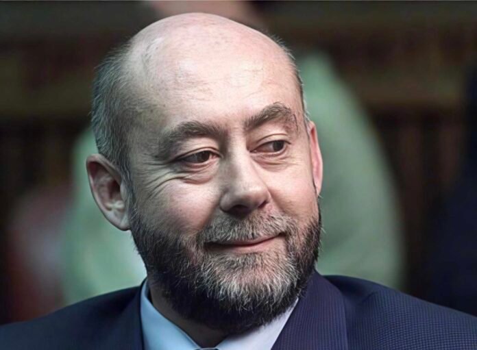 Wouter Basson, the apartheid-era doctor known as ‘Dr Death’, in a dark suit and blue shirt.