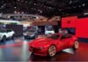 Alfa Romeo Cuorerosso: Multi-energy future revealed at Paris 2026 Red Alfa Romeo Cuorerosso concept car on display at the 2026 Paris Motor Show, surrounded by other Alfa models.