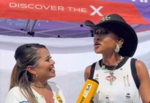 Mahindra Fusion Fest channels raw campus culture and South African rising talent at Wits NOWinSA field reporter Darsh Meyer interviews MC Moozlie at Mahindra Fusion Fest, holding a yellow branded microphone.