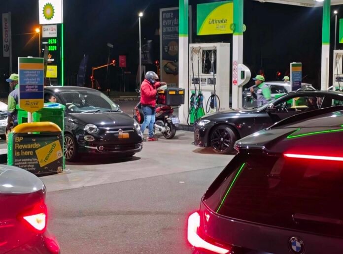 Motorists queue at a BP petrol station in Fourways ahead of the October fuel price increase
