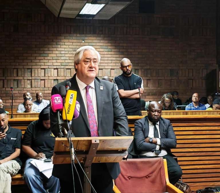Advocate Hendrik Potgieter speaks at a lectern during Suliman Carrim’s bail hearing.