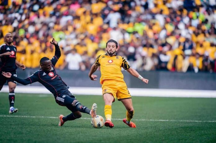 Orlando Pirates' Kamogelo Sebelele tackles Kaizer Chiefs' Ethan Chislett during the Soweto Derby.